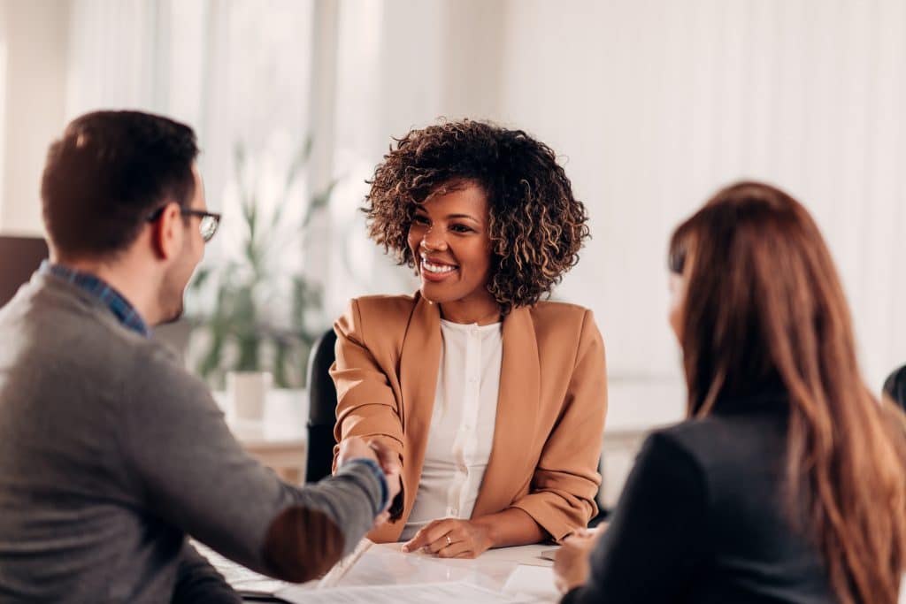 Business people shaking hands after successful meeting